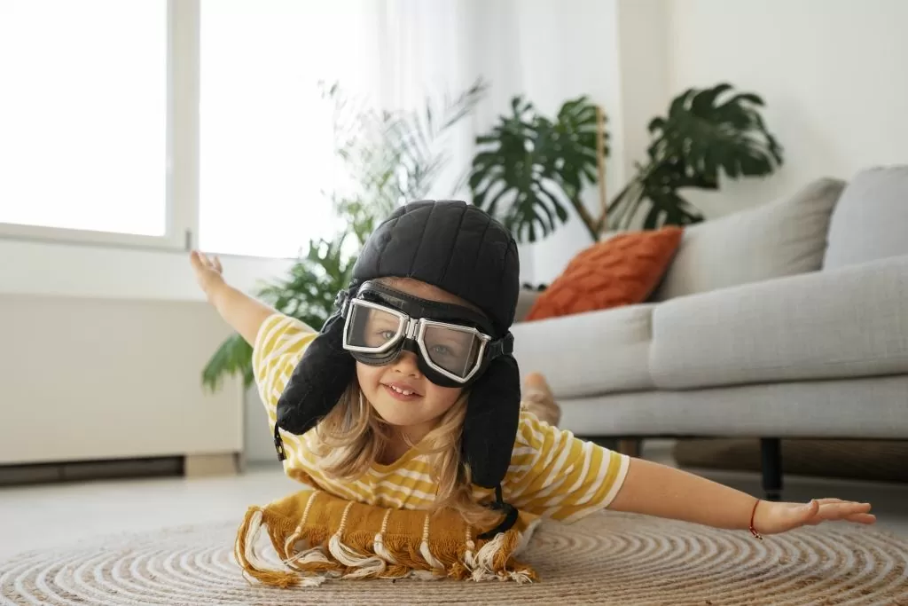 full-shot-girl-playing-with-flying-goggles.jpg